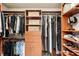 Well-organized walk-in closet with custom shelving, drawers, and ample storage for clothing at 3906 Twin Rivers Trl, Parrish, FL 34219
