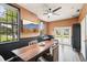Room with dark wood floors and a large conference table at 3906 Twin Rivers Trl, Parrish, FL 34219