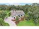 Charming two-story home with landscaped yard, driveway, and mature trees at 3906 Twin Rivers Trl, Parrish, FL 34219