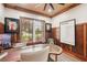 Sophisticated home office with wood trim, a decorative rug, and ample natural light at 3906 Twin Rivers Trl, Parrish, FL 34219