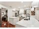 Bright, modern kitchen with marble countertops, stainless steel appliances, and a wine rack feature at 3906 Twin Rivers Trl, Parrish, FL 34219