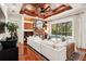 Bright and airy living room featuring hardwood floors, comfortable seating, and elegant fireplace at 3906 Twin Rivers Trl, Parrish, FL 34219
