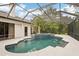 Screened-in pool and lanai with a spa and mature trees, offering privacy and a resort-like experience at 3906 Twin Rivers Trl, Parrish, FL 34219