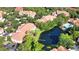 Beautiful aerial view of property featuring pond, buildings, and well-maintained landscaping at 4140 Central Sarasota Pkwy # 1235, Sarasota, FL 34238