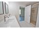 Beautiful bathroom featuring double sinks, quartz countertops, and a shower at 4140 Central Sarasota Pkwy # 1235, Sarasota, FL 34238