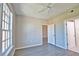 A well-lit bedroom with wood-look floors and neutral walls is a blank slate at 4140 Central Sarasota Pkwy # 1235, Sarasota, FL 34238