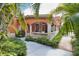 Welcoming clubhouse features a covered porch with decorative railings and surrounding greenery at 4140 Central Sarasota Pkwy # 1235, Sarasota, FL 34238