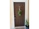 Inviting front door with wreath and decorative door hardware at 4140 Central Sarasota Pkwy # 1235, Sarasota, FL 34238