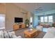 Open-concept living room with hardwood floors, recessed lighting, and neutral decor at 4140 Central Sarasota Pkwy # 1235, Sarasota, FL 34238
