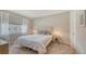 Comfortable bedroom featuring a plush bed, neutral tones, and a bright window view at 4267 Expedition Way, Osprey, FL 34229
