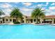 A sparkling community pool features a spacious pool deck and relaxing lounge chairs at 4267 Expedition Way, Osprey, FL 34229