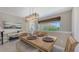 Comfortable dining space with natural lighting, stylish decor, and a view overlooking the community at 4267 Expedition Way, Osprey, FL 34229