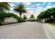 A charming brick-paved entrance with a gate welcomes you to the Bay Street community at 4267 Expedition Way, Osprey, FL 34229
