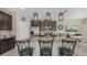 Beautiful kitchen featuring stainless steel appliances, granite countertops, and stylish pendant lighting at 4267 Expedition Way, Osprey, FL 34229