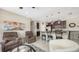 Open-concept living space with kitchen bar, living area seating, and stainless appliances at 4267 Expedition Way, Osprey, FL 34229