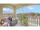 A covered patio with comfortable seating offers views of the community at 4267 Expedition Way, Osprey, FL 34229