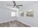 Bright bedroom featuring wood-look flooring and two large windows for plenty of natural light at 4505 18Th W Ave, Bradenton, FL 34209