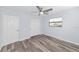Bright bedroom featuring a ceiling fan, neutral walls, and hardwood floors, complemented by a large window at 4505 18Th W Ave, Bradenton, FL 34209