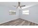 This is a bedroom with lots of natural light, a ceiling fan and wood look flooring at 4505 18Th W Ave, Bradenton, FL 34209