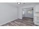 Open dining area features modern wood-look flooring, and an open view to another room at 4505 18Th W Ave, Bradenton, FL 34209