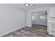 Open dining area features modern wood-look flooring, and an open view to another room at 4505 18Th W Ave, Bradenton, FL 34209