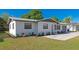 Well-maintained single-story home featuring fresh landscaping, a metal roof, and an attached garage at 4505 18Th W Ave, Bradenton, FL 34209