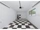 Spacious garage featuring checkerboard flooring and laundry hookups at 4505 18Th W Ave, Bradenton, FL 34209