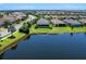 A backyard featuring a serene lake view in a well-maintained community at 4704 Sarca Ct, Lakewood Ranch, FL 34211