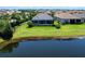 A lush backyard with a screened-in pool, offering privacy and tranquility in a serene setting near the lake at 4704 Sarca Ct, Lakewood Ranch, FL 34211