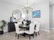 Dining room features modern lighting, wood-look tile floors and decorative accents at 4704 Sarca Ct, Lakewood Ranch, FL 34211