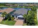 Beautiful home with well-kept lawn, landscaping and a tranquil water view in a desirable community at 4704 Sarca Ct, Lakewood Ranch, FL 34211