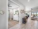 Hallway provides access to rooms, displays modern tile flooring and has natural lighting at 4704 Sarca Ct, Lakewood Ranch, FL 34211