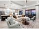 Spacious living room featuring an open floor plan, modern furnishings, and bright, natural light, perfect for entertaining at 4704 Sarca Ct, Lakewood Ranch, FL 34211