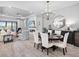 Open concept living and dining area with modern decor and seamless flow at 4704 Sarca Ct, Lakewood Ranch, FL 34211