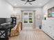 Office space featuring a desk, chair, bookcase, cabinet, neutral paint and tile floor at 4704 Sarca Ct, Lakewood Ranch, FL 34211