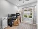Office space with a desk, chair, bookcase, cabinet, neutral paint and tile floor at 4704 Sarca Ct, Lakewood Ranch, FL 34211
