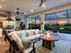 Stylish outdoor living space with a fire pit, comfortable seating, and scenic lake views, perfect for entertaining at 4704 Sarca Ct, Lakewood Ranch, FL 34211