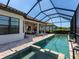 A stunning screened-in pool featuring a spa and lounge area perfect for relaxation and outdoor enjoyment at 4704 Sarca Ct, Lakewood Ranch, FL 34211