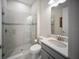 Modern bathroom featuring tiled shower, stylish vanity, and sleek fixtures at 4735 Cassio Ct, Bradenton, FL 34211
