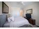 Comfortable bedroom featuring soft, neutral tones, closet and television for relaxation at 4735 Cassio Ct, Bradenton, FL 34211