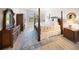 Stately bedroom features hardwood floors, four poster bed, and stylish decor at 4735 Cassio Ct, Bradenton, FL 34211