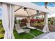 Relaxing cabana with lounge chairs, tropical plants, and shade at 4735 Cassio Ct, Bradenton, FL 34211