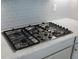 Close up of stainless steel 5 burner cooktop at 4735 Cassio Ct, Bradenton, FL 34211