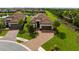 Beautiful home with a tile roof, lush landscaping, and well-manicured lawn at 4735 Cassio Ct, Bradenton, FL 34211
