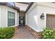 A brick-paved path leads to the inviting front door of this beautifully landscaped home at 4735 Cassio Ct, Bradenton, FL 34211