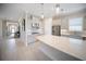 Bright kitchen with tile flooring, stone countertops, and modern appliances, spacious and open-concept at 4735 Cassio Ct, Bradenton, FL 34211