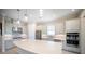 Modern kitchen with stainless steel appliances, ample counter space, and stylish pendant lighting at 4735 Cassio Ct, Bradenton, FL 34211