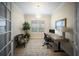 Stylish home office featuring a modern desk, chair, and ample natural light at 4735 Cassio Ct, Bradenton, FL 34211