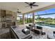 Enjoy the screened lanai with a fully equipped outdoor kitchen and a private pool overlooking the serene lake at 4735 Cassio Ct, Bradenton, FL 34211