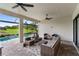 This spacious patio features comfortable seating arrangements and a clear view of a backyard, perfect for outdoor gatherings at 4735 Cassio Ct, Bradenton, FL 34211
